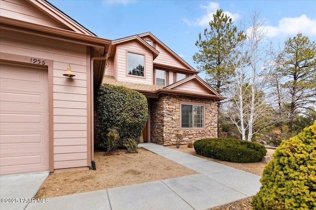 doorway to property featuring stone siding