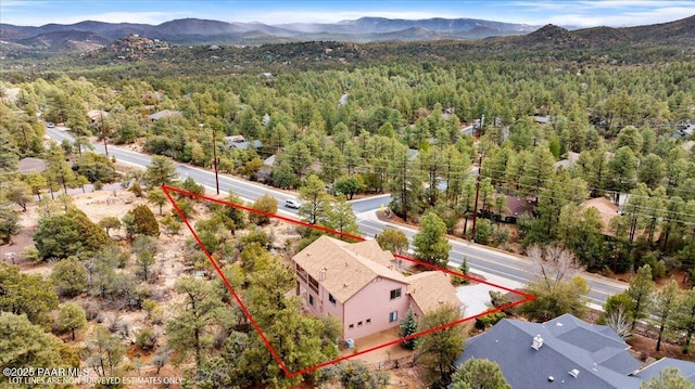 bird's eye view with a view of trees and a mountain view