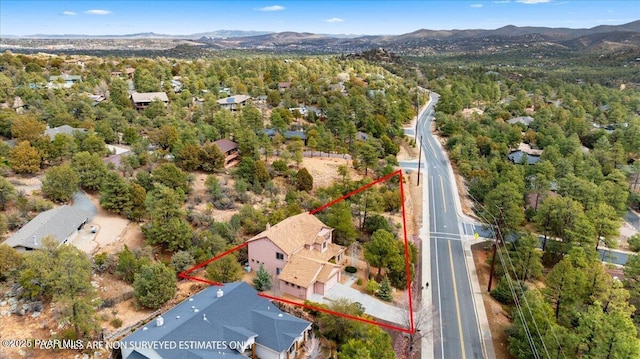 bird's eye view with a view of trees and a mountain view