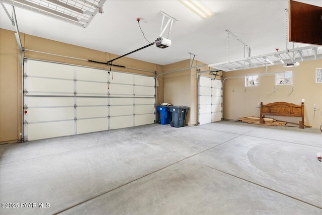 garage featuring a garage door opener