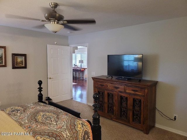 bedroom featuring ceiling fan and light colored carpet