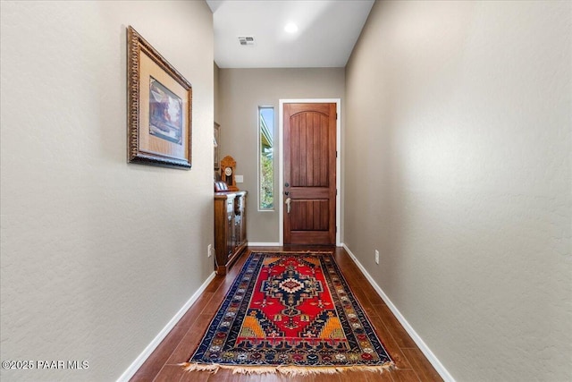 doorway featuring dark hardwood / wood-style floors