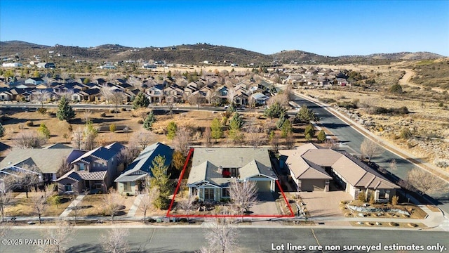 birds eye view of property with a mountain view