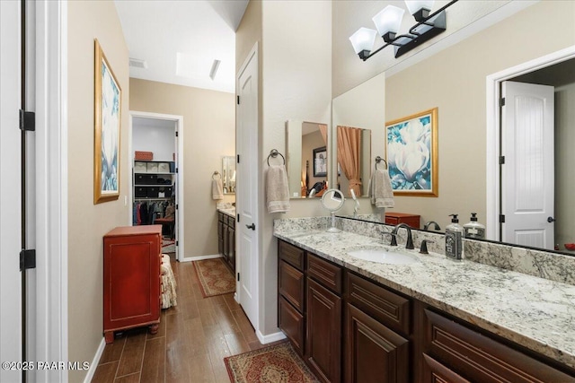 bathroom with vanity and wood-type flooring