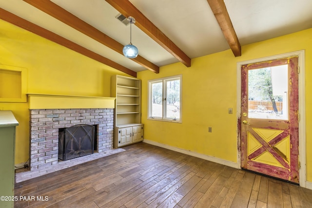 769 Cherokee Rd, Prescott, AZ 86303 - unfurnished living room with a brick fireplace, plenty of natural light, and dark wood-style flooring