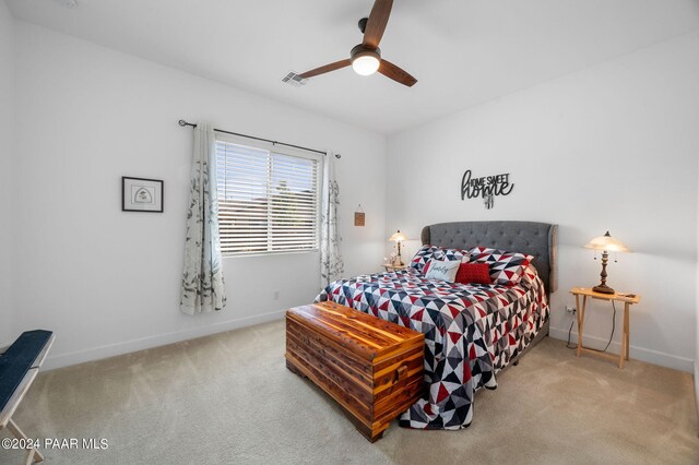 carpeted bedroom featuring ceiling fan