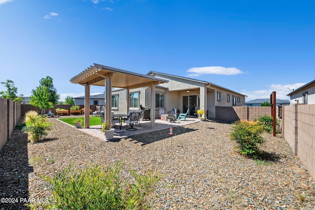 rear view of house featuring a patio area