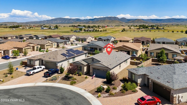 drone / aerial view featuring a mountain view