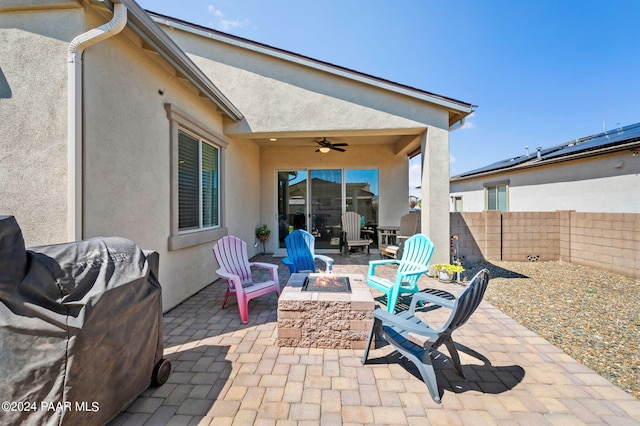 view of patio with a fire pit and a grill