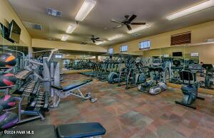 exercise room with ceiling fan