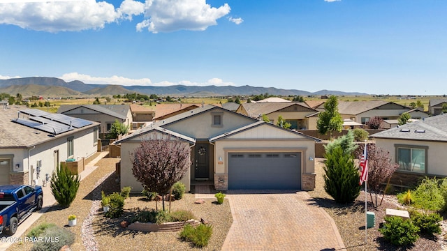 view of front of house featuring a mountain view and a garage