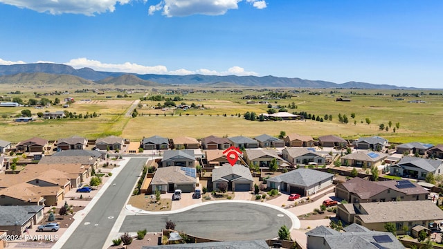 birds eye view of property featuring a mountain view