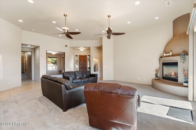 tiled living room featuring ceiling fan