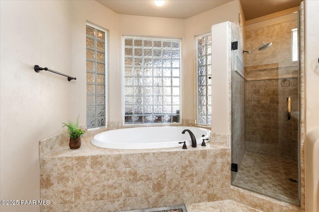 bathroom with shower with separate bathtub