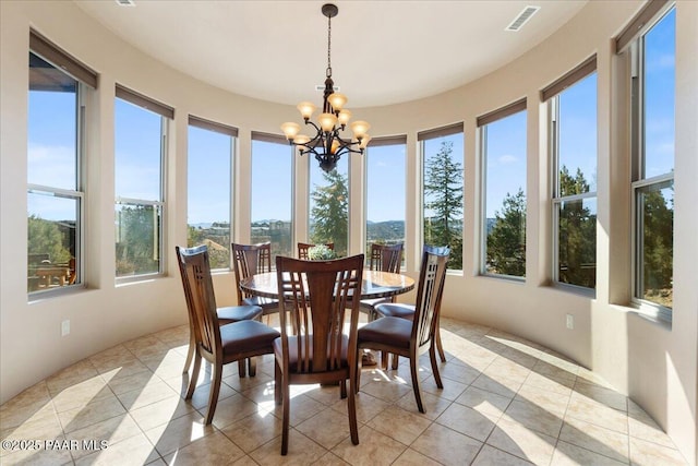 sunroom with an inviting chandelier