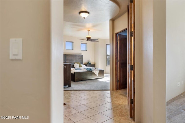 hallway featuring light tile patterned floors