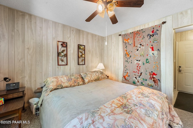 5980 S Old Walker Rd, Prescott, AZ 86303 - carpeted bedroom with wooden walls, a ceiling fan, and a textured ceiling