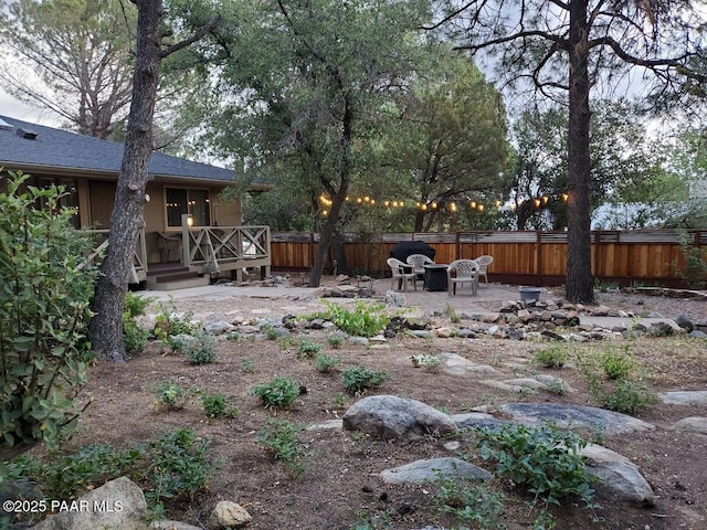 view of yard featuring a patio and fence