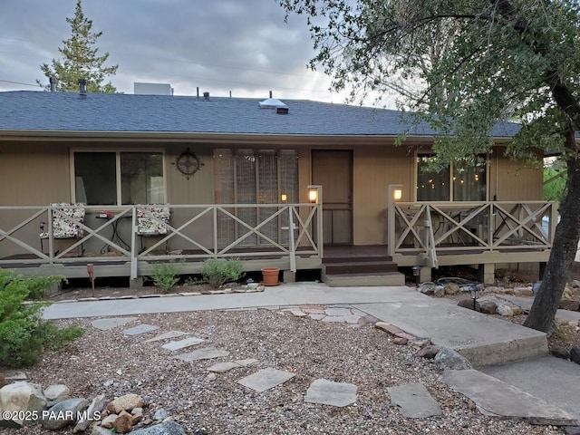 view of front of house featuring a porch and a shingled roof