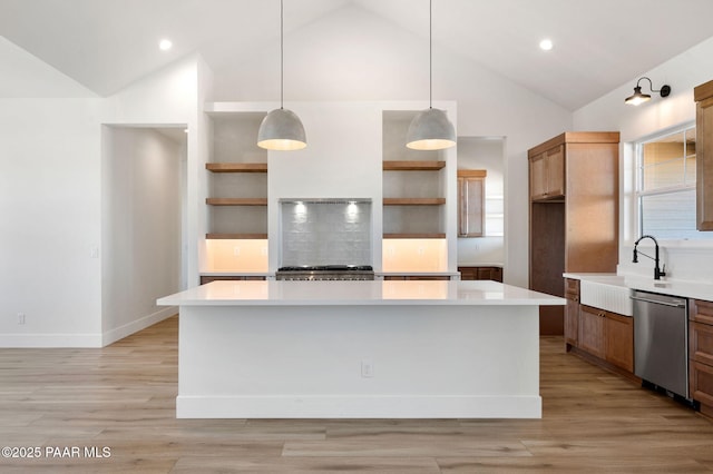 kitchen with stainless steel dishwasher, a sink, open shelves, and light countertops