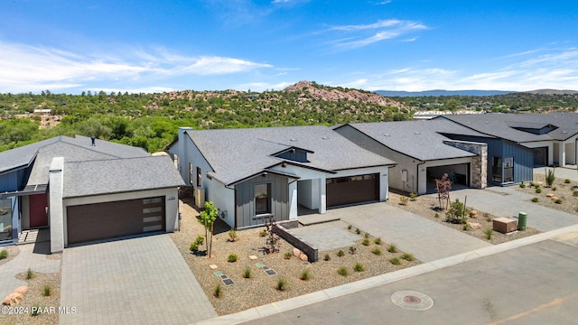 view of front of house with a mountain view and a garage