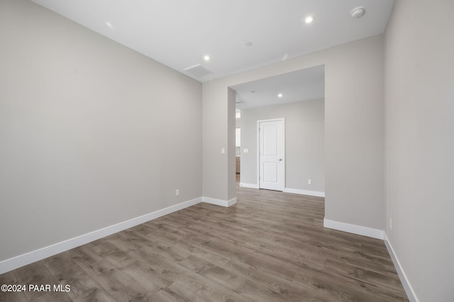 spare room featuring hardwood / wood-style flooring