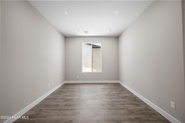 unfurnished room with dark hardwood / wood-style floors