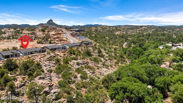 birds eye view of property featuring a mountain view