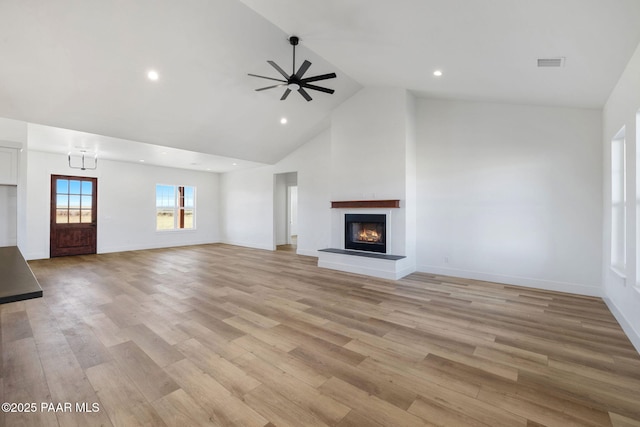 unfurnished living room featuring ceiling fan, high vaulted ceiling, and light hardwood / wood-style floors