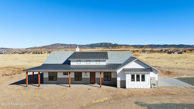 modern farmhouse style home with a mountain view