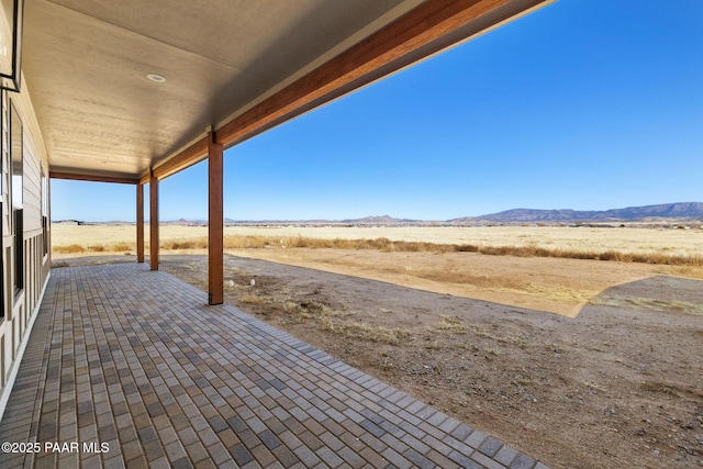 view of patio / terrace featuring a mountain view