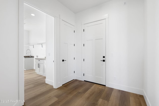 hall with light hardwood / wood-style floors