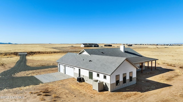 birds eye view of property featuring a rural view