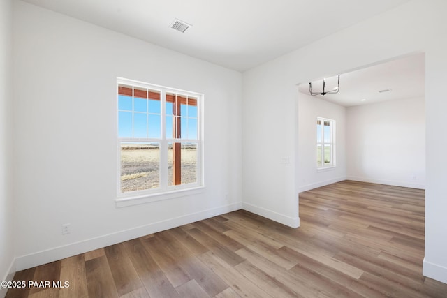 spare room featuring light hardwood / wood-style floors