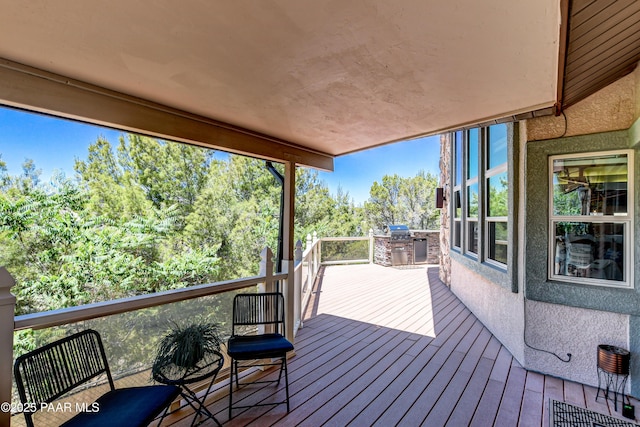 wooden terrace with area for grilling and grilling area