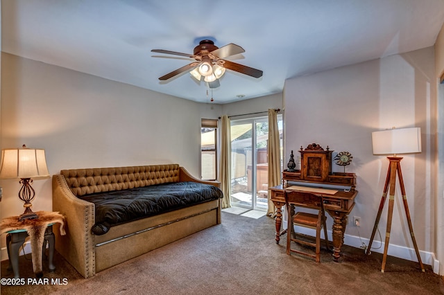 interior space with carpet floors and ceiling fan