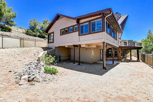 back of house with a patio