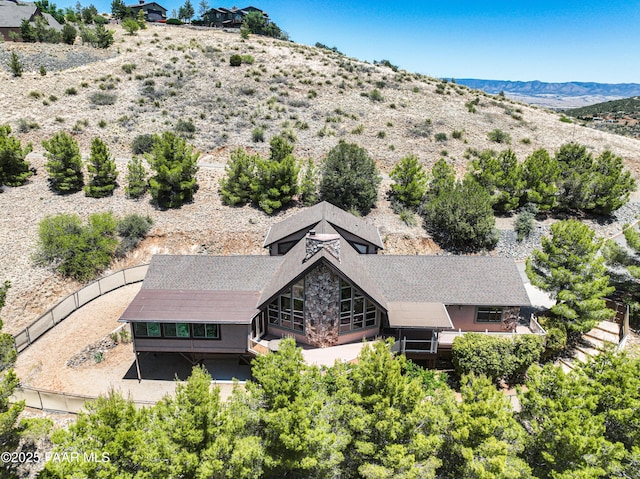 birds eye view of property with a mountain view