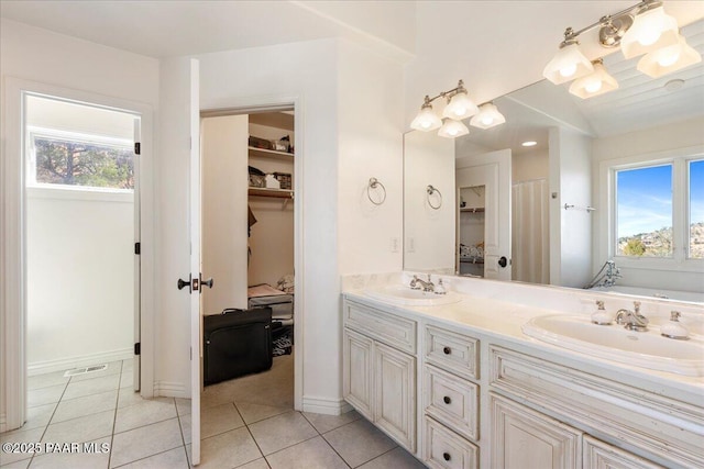 1310 W Carlock Dr, Prescott, AZ 86305 - bathroom featuring plenty of natural light, double vanity, and tile patterned floors