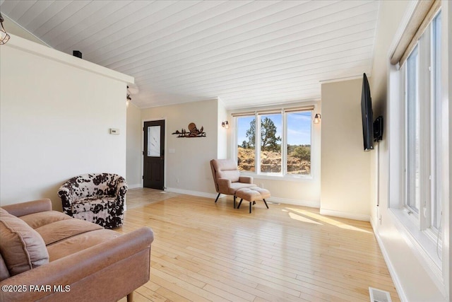 1310 W Carlock Dr, Prescott, AZ 86305 - living room featuring light wood-type flooring, baseboards, and wood ceiling