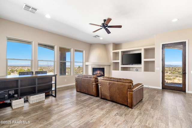 12300 W Slate Rd, Prescott, AZ 86305 - living room with recessed lighting, wood finished floors, visible vents, and baseboards