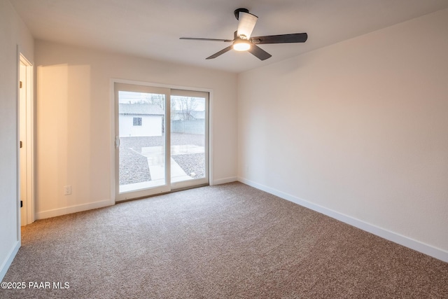 spare room with carpet flooring, baseboards, and ceiling fan