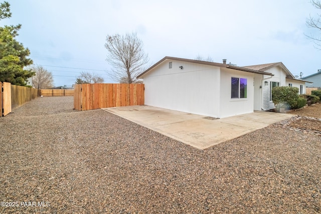 exterior space featuring a patio area and fence