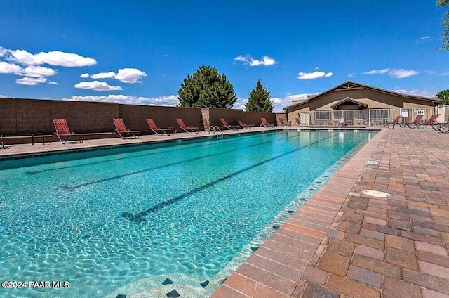 view of swimming pool with a patio area