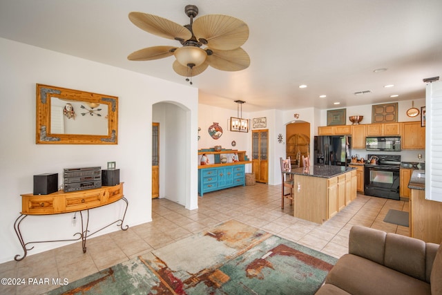 interior space with light tile patterned floors and ceiling fan with notable chandelier