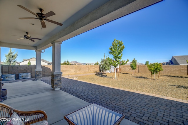 5306 Rocky Vista Dr, Prescott, AZ 86301 - fenced backyard with ceiling fan and a patio area