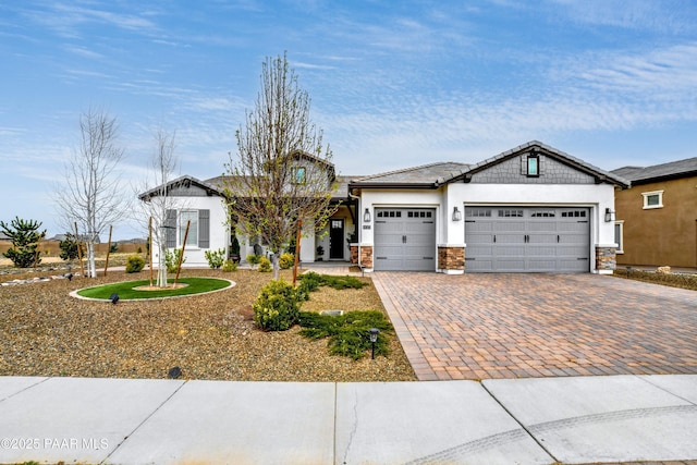 5306 Rocky Vista Dr, Prescott, AZ 86301 - view of front of house with a garage, driveway, stone siding, and stucco siding