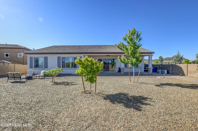 5306 Rocky Vista Dr, Prescott, AZ 86301 - back of house featuring a patio, a fenced backyard, stucco siding, and outdoor lounge area