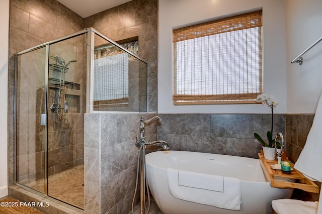 5306 Rocky Vista Dr, Prescott, AZ 86301 - bathroom with a soaking tub, a shower stall, and tile walls