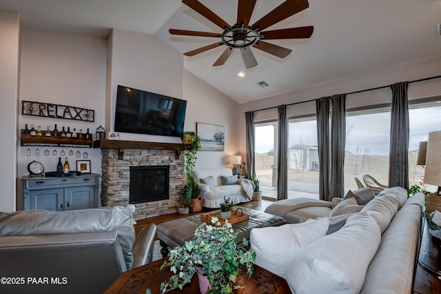 5306 Rocky Vista Dr, Prescott, AZ 86301 - living area with ceiling fan, lofted ceiling, a stone fireplace, and wood finished floors
